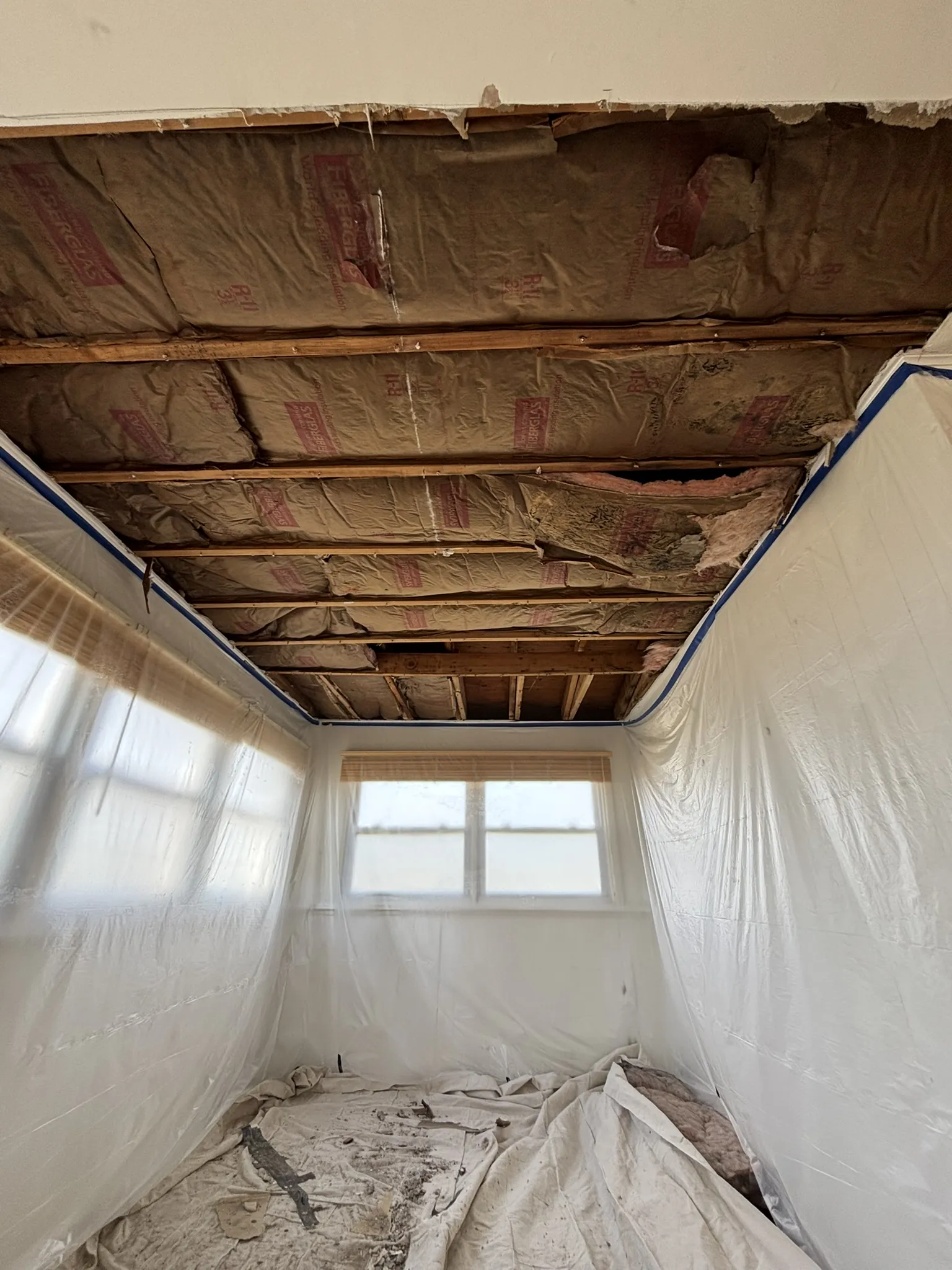 During: the textured ceiling removed down to the joists in a Mays Landing, NJ home