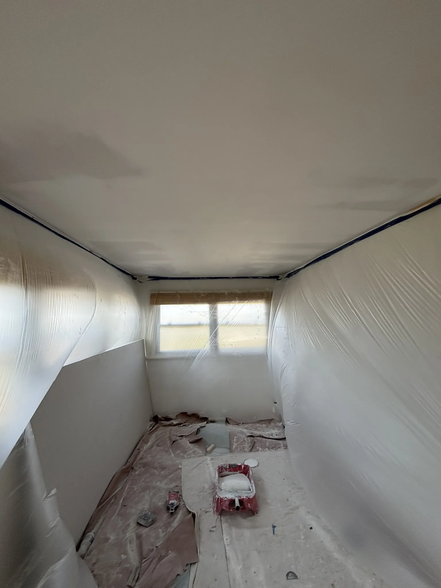 During: new drywall hung and the first mud coat applied to the ceiling in Mays Landing, NJ