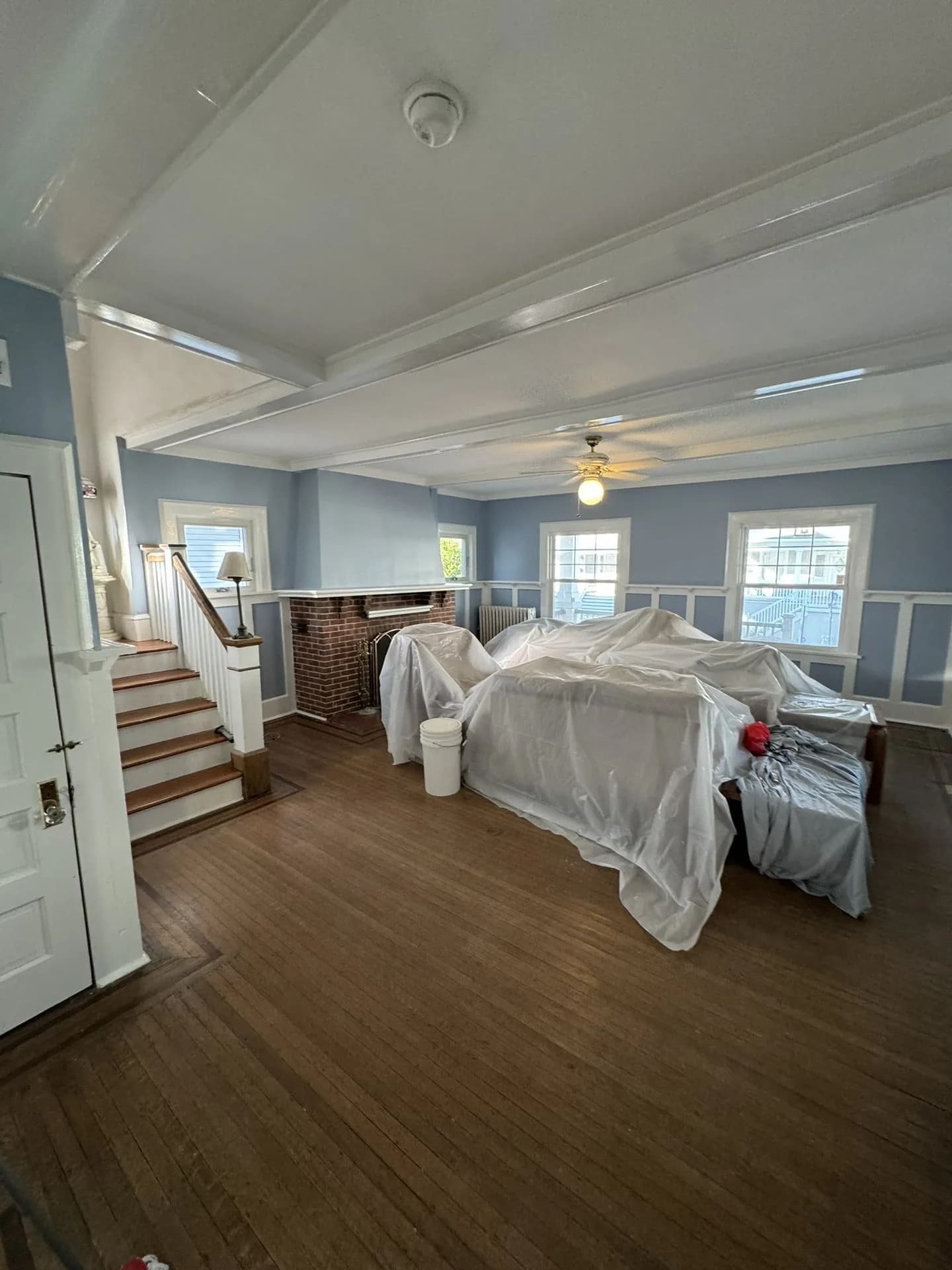 Living room with blue wainscoting and flat-finish walls painted in Atlantic City NJ